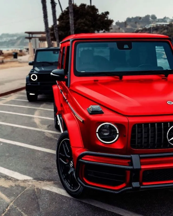 Bright Red Mercedes G Wagon in Coastal Parking Lot image