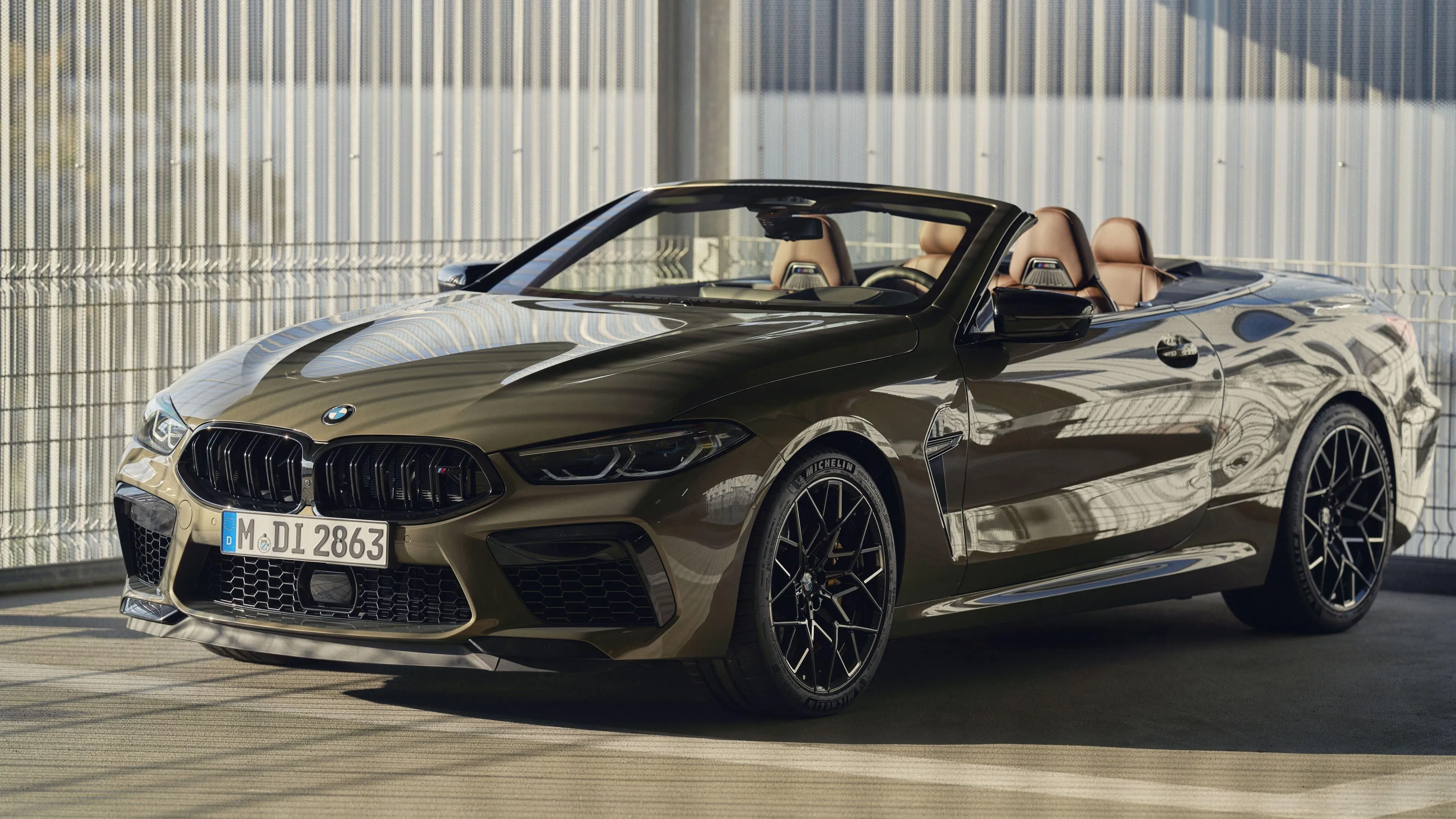 Brown Bmw Convertible Parked in Sunlight By Glass Building