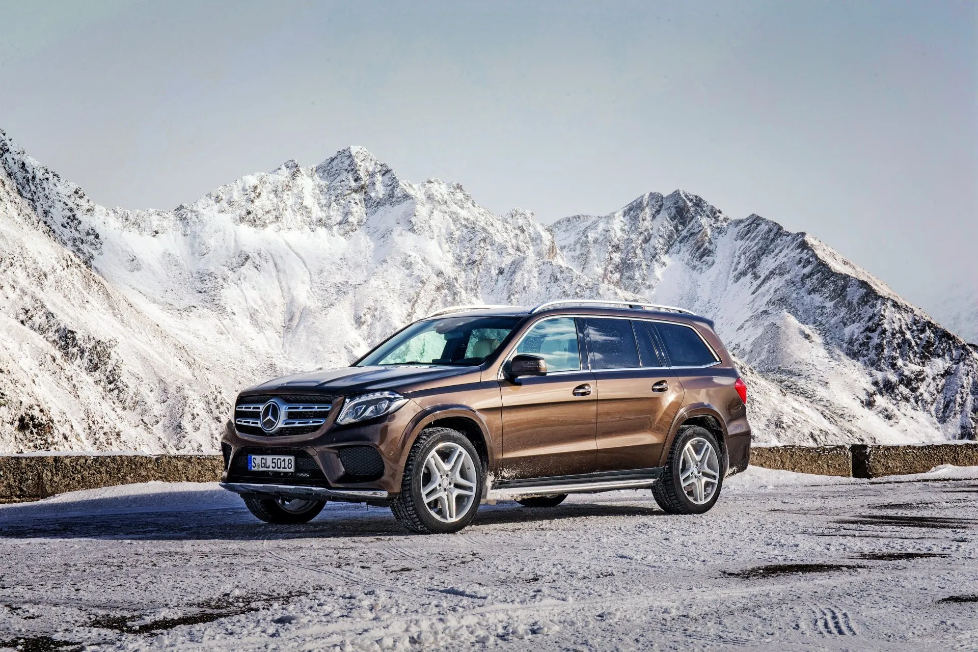 Brown Mercedes Benz SUV Parked in Snowy Mountain Environment