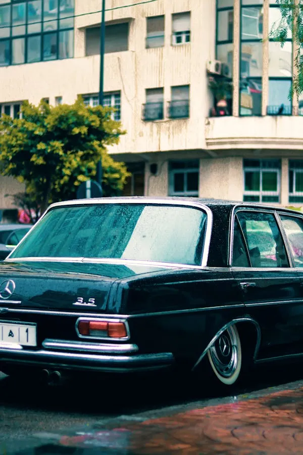 Classic Benz Parked Outside Modern Glass Office Wallpaper