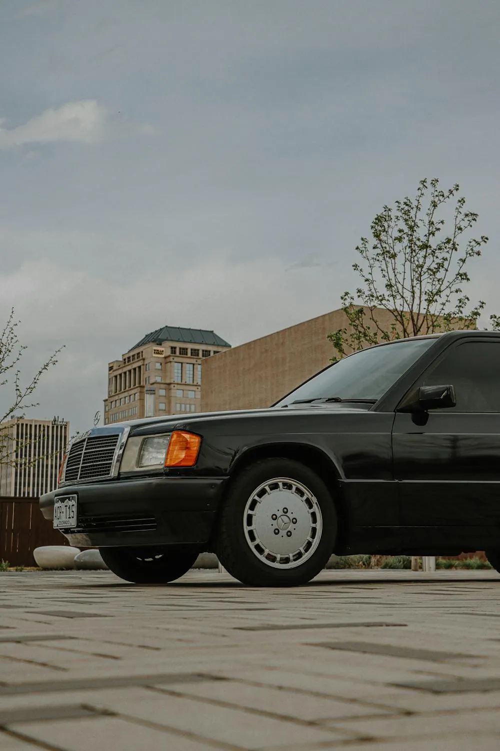 Classic Black Mercedes Parked in Neighborhood Wallpaper