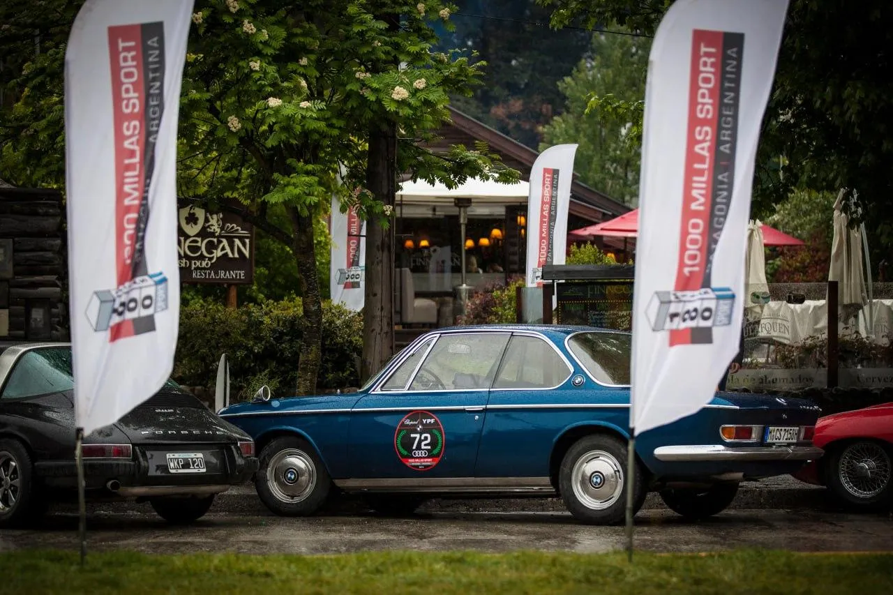 Classic Bmw Car at Vintage Show with Flags in Background