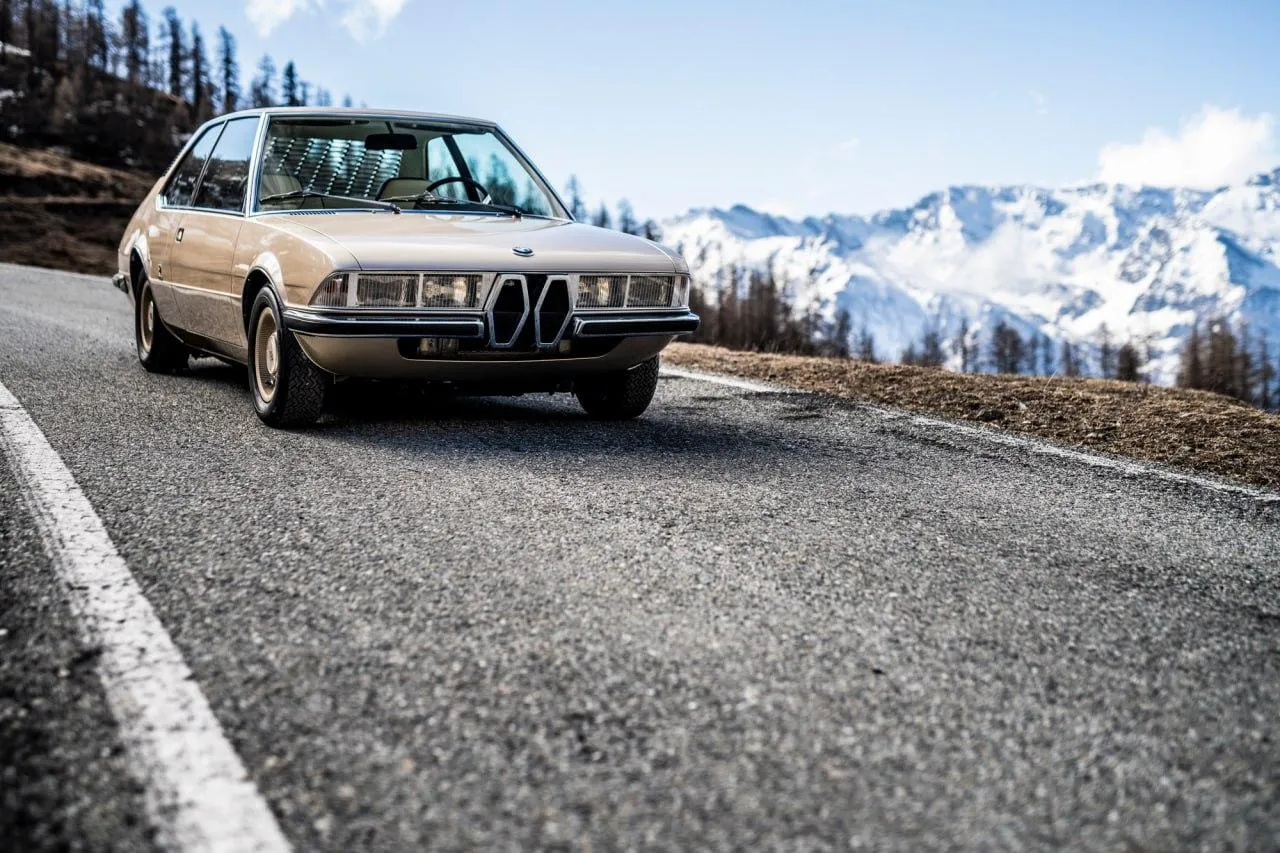 Classic Bmw Car Parked Near a Snowy Mountain Roadside
