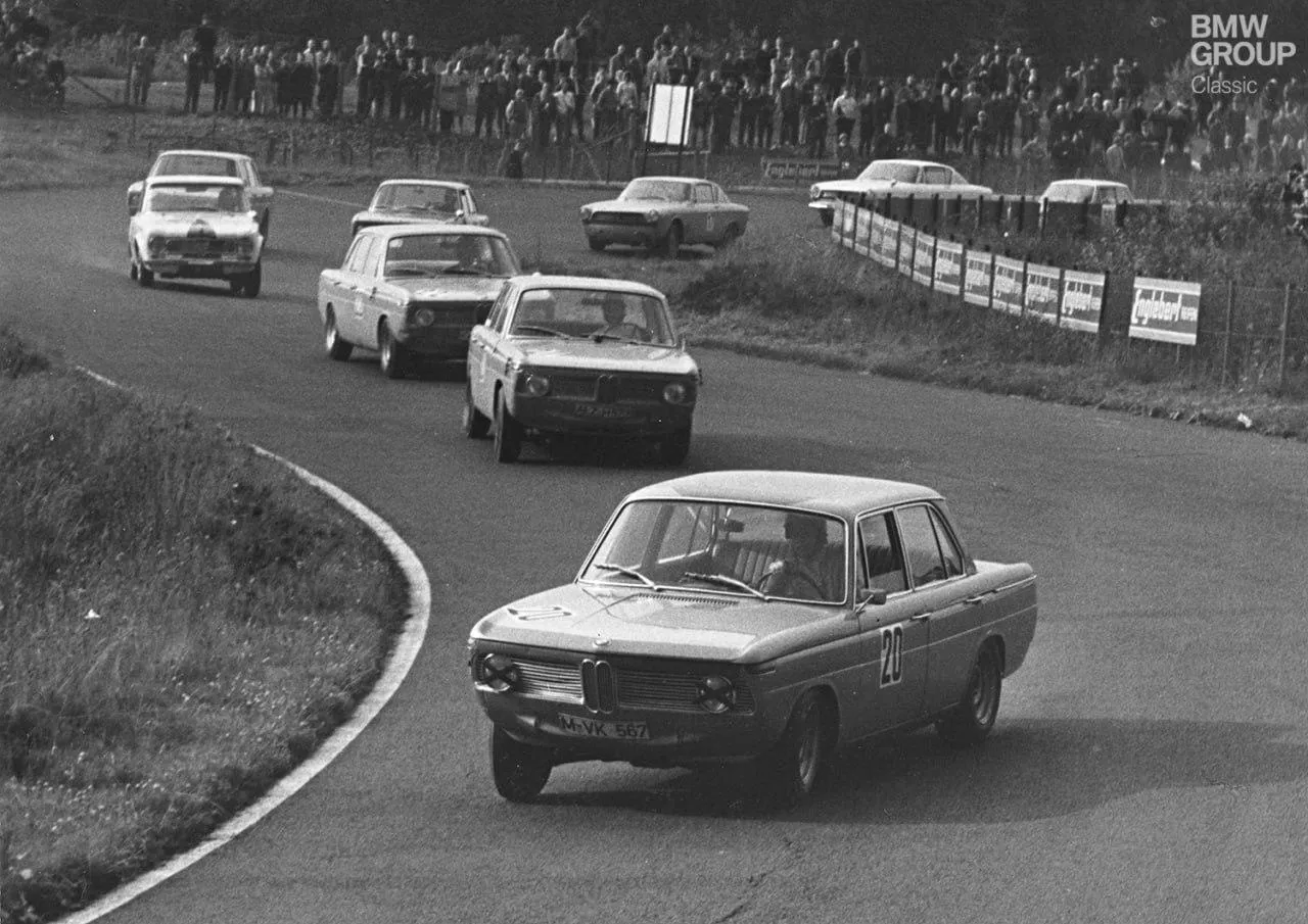 Classic Bmw Cars Racing on a Curved Vintage Track