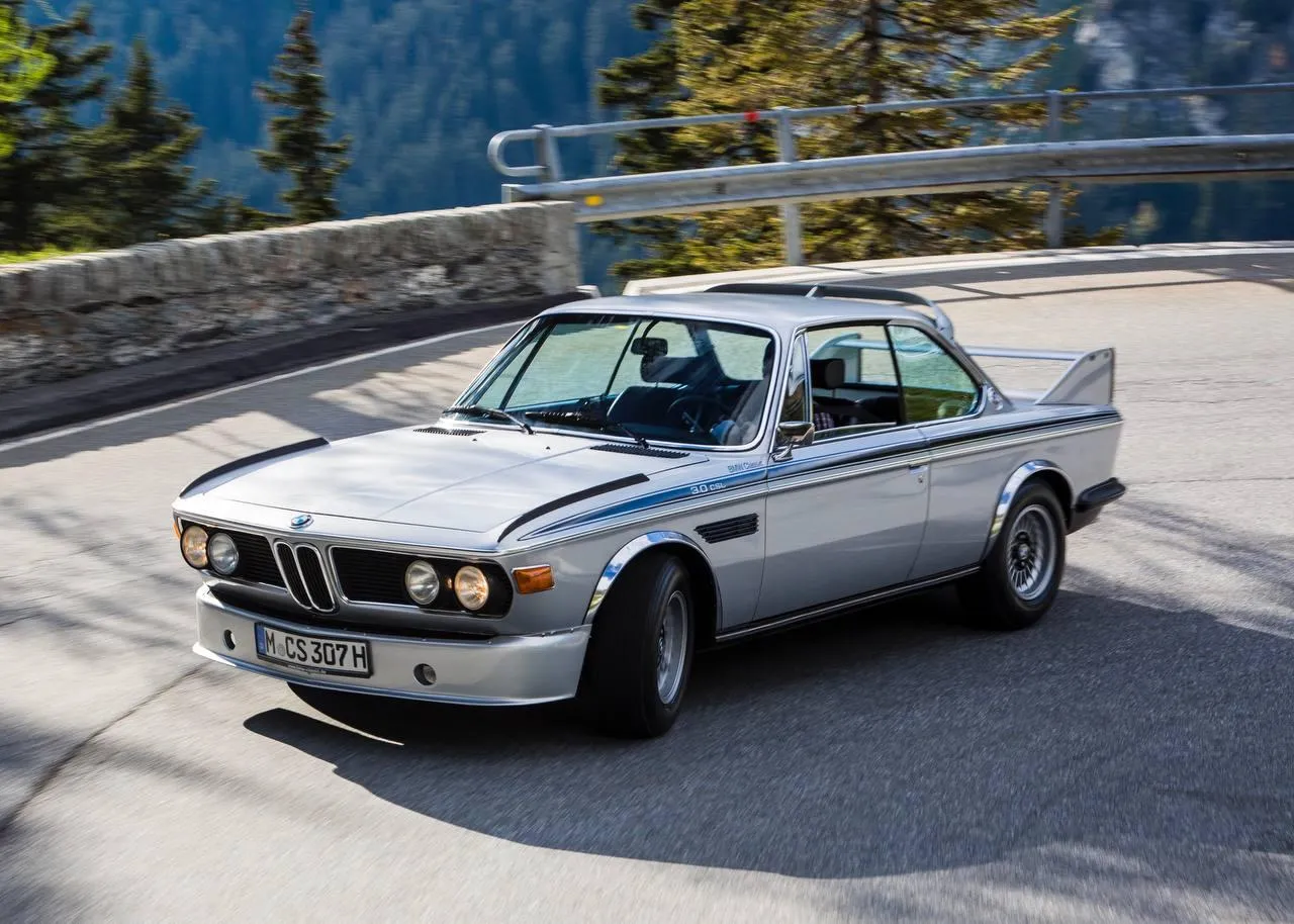 Classic Bmw Coupe Driving Through Mountain Road Curves