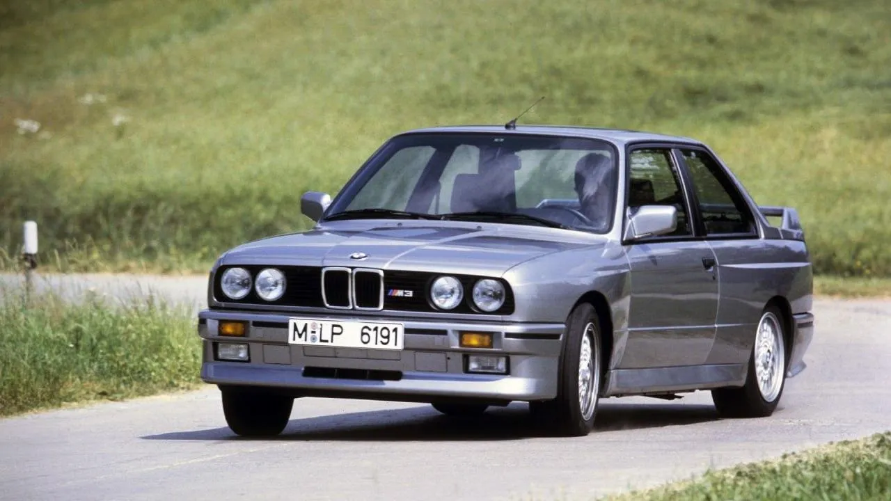 Classic Bmw Driving on Country Road with Hills in View