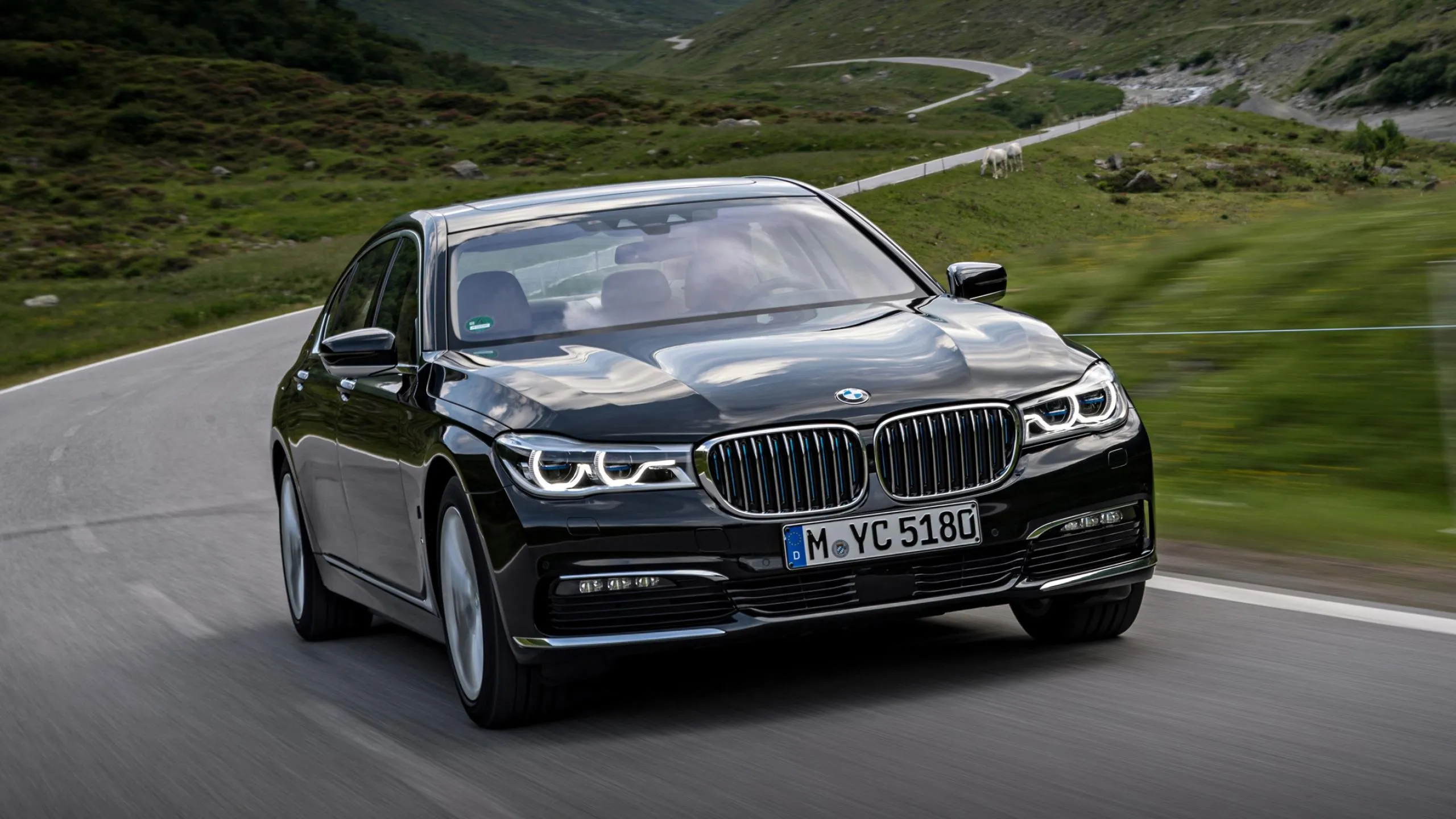 Classic Bmw Driving Through Scenic Countryside Road