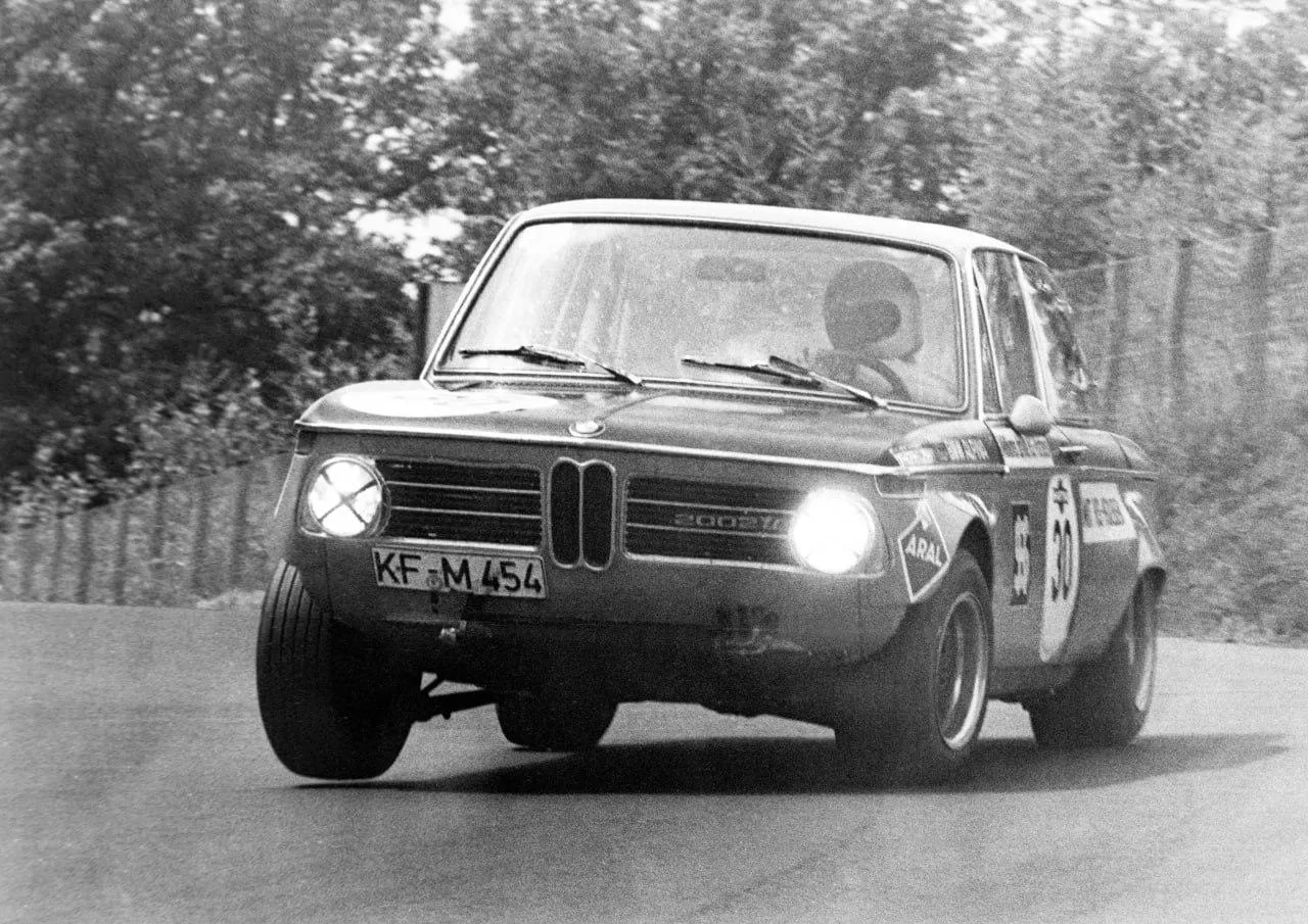 Classic Bmw in Black and White Driving on an Open Road
