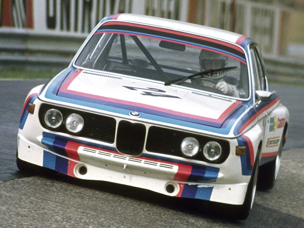 Classic Bmw Race Car with Red and Blue Livery Parked