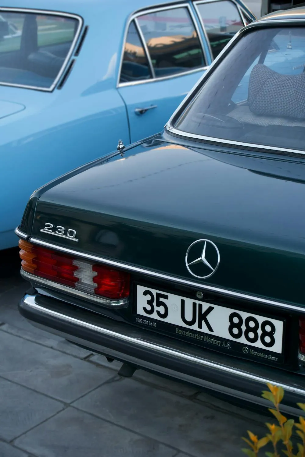 Classic Green Mercedes Parked Beside Vintage Blue Car