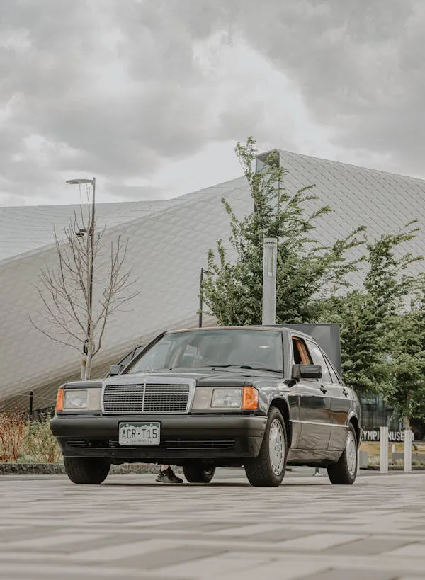 Classic Mercedes Benz Car Parked in Modern Architecture