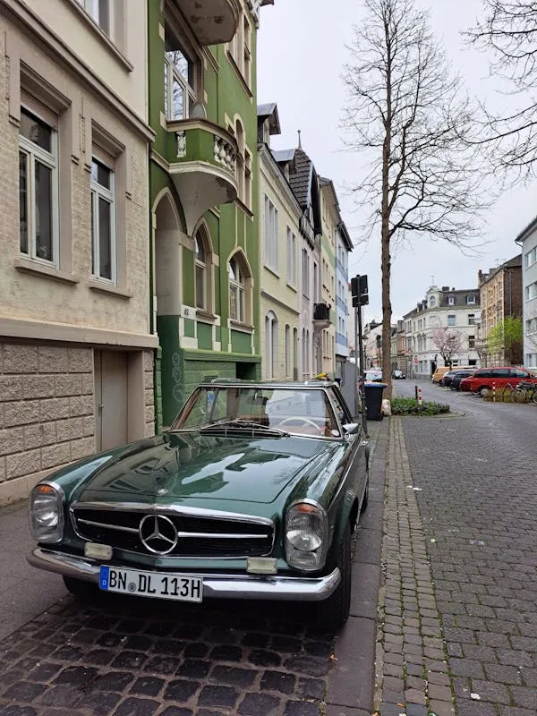 Classic Mercedes Benz Convertible Parked in Alley Wallpaper