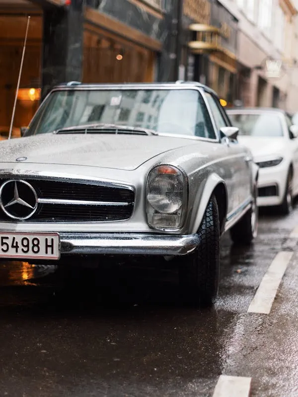 Classic Mercedes Benz Driving Through City Streets image