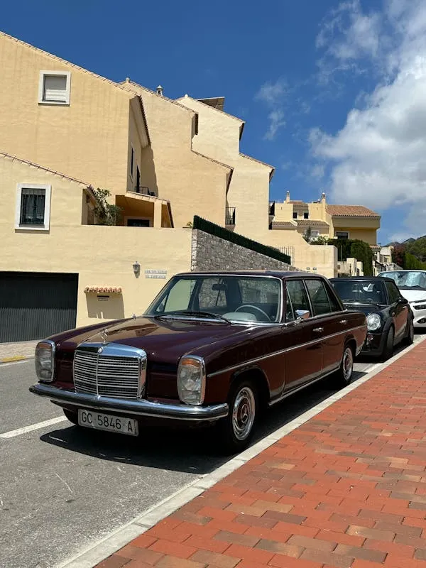 Classic Mercedes Benz Parked on Brick Sidewalk Street