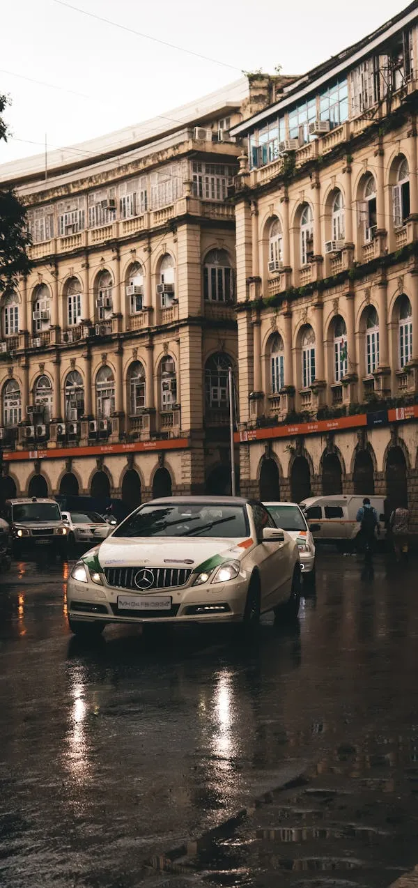 Classic Mercedes Driving Through European City Streets