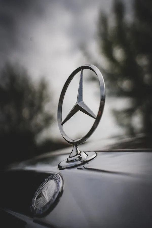 Classic Mercedes Emblem on Hood at Sunset free Wallpaper