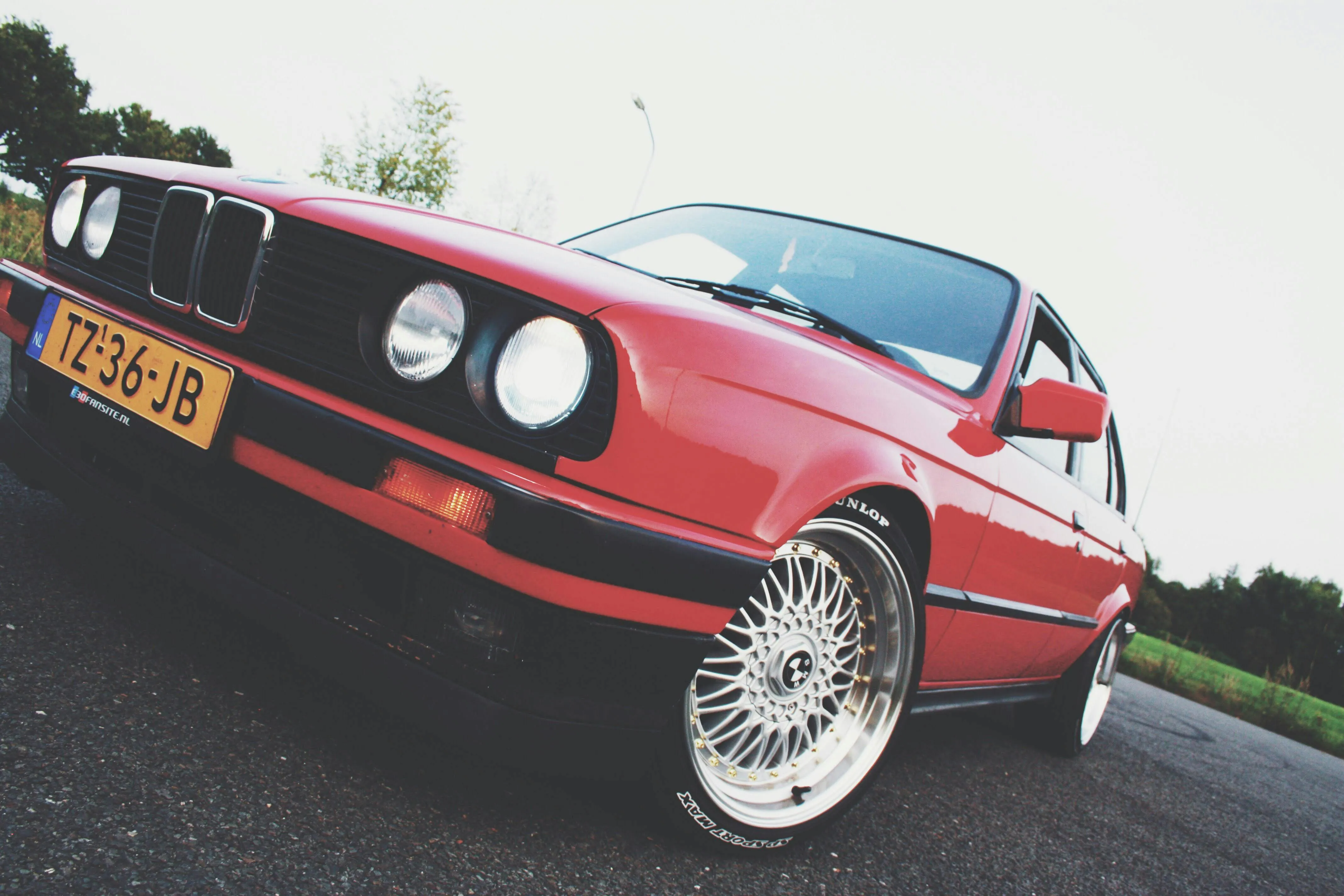 Classic Red Bmw Car Parked at an Angle in Open Area