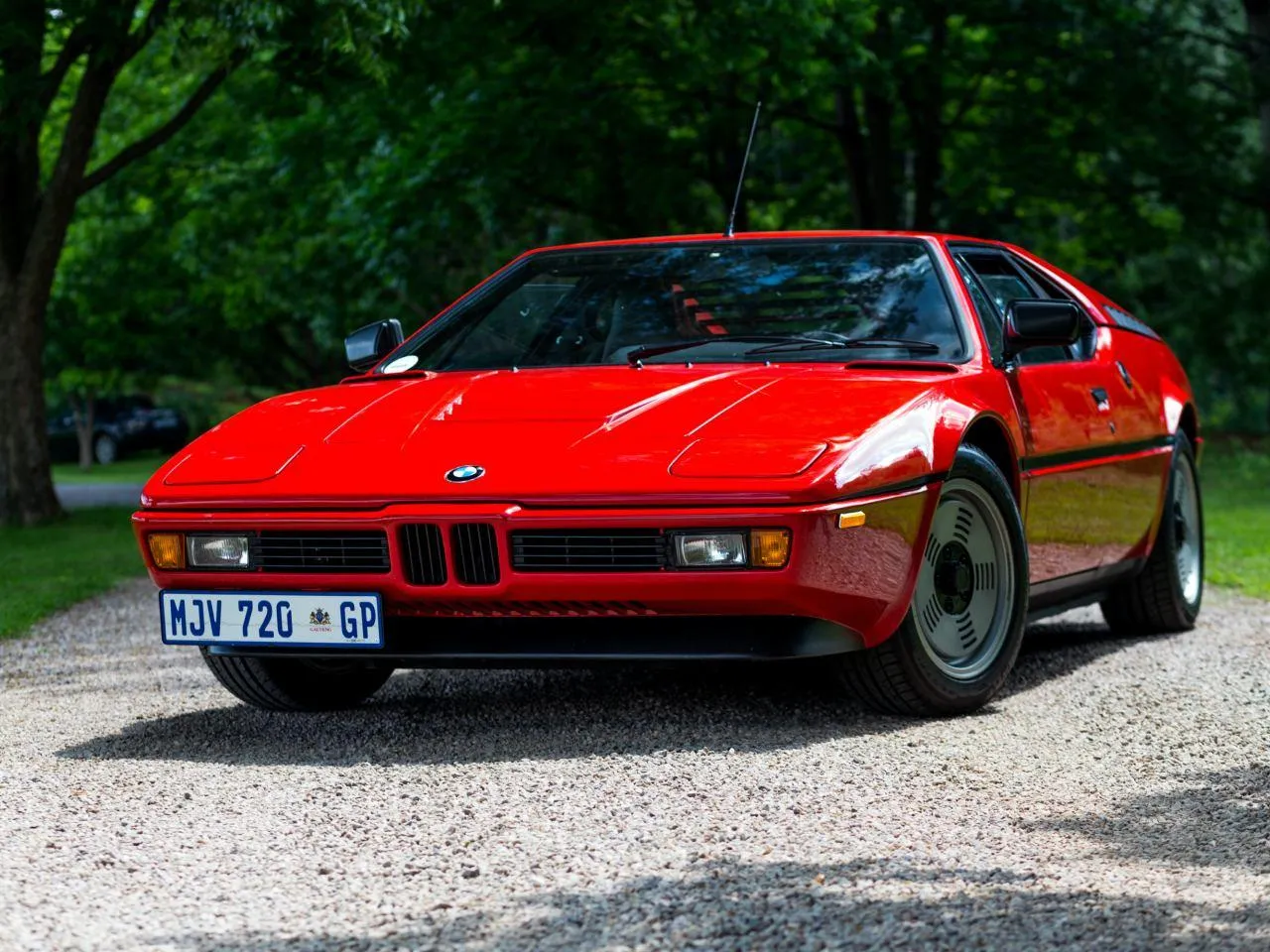 Classic Red Bmw Car Parked on Gravel Road Free Hd Image