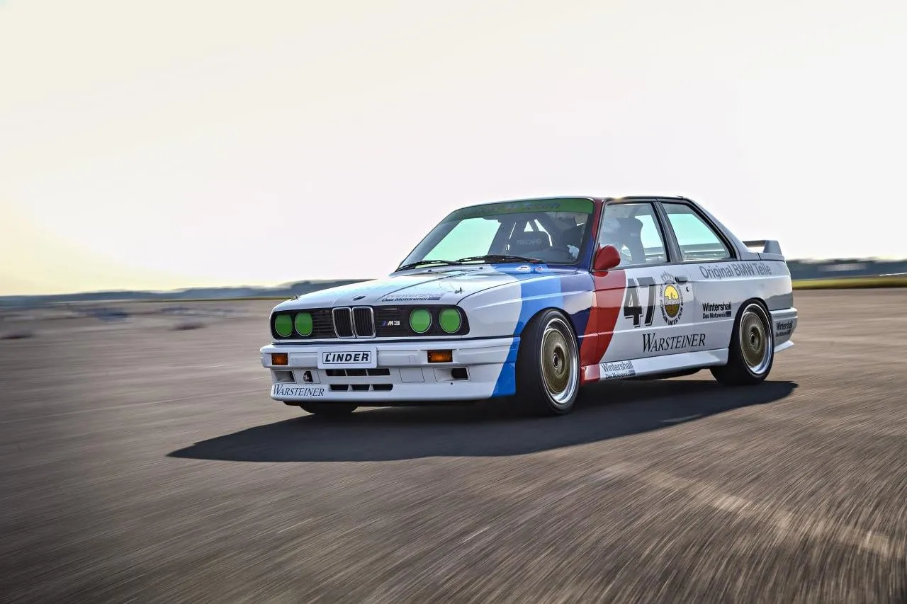 Classic White Bmw Race Car on an Empty Race Track Wallpaper