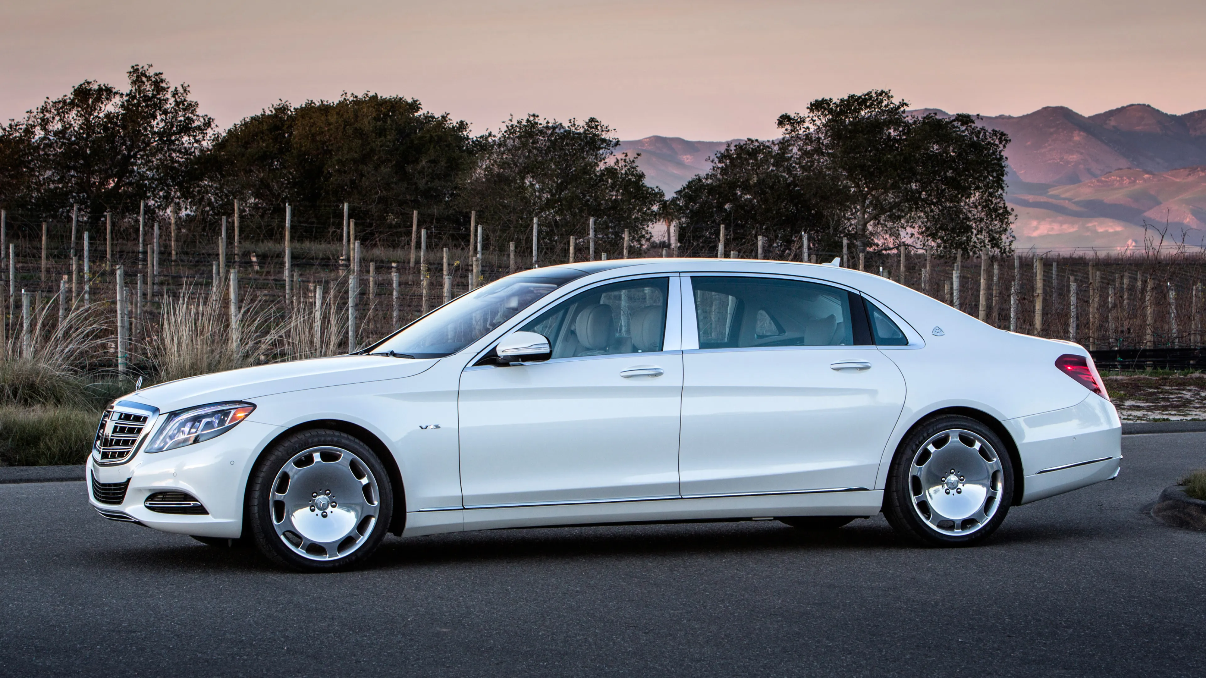 Classic White Mercedes Benz Luxury Sedan at Sunset
