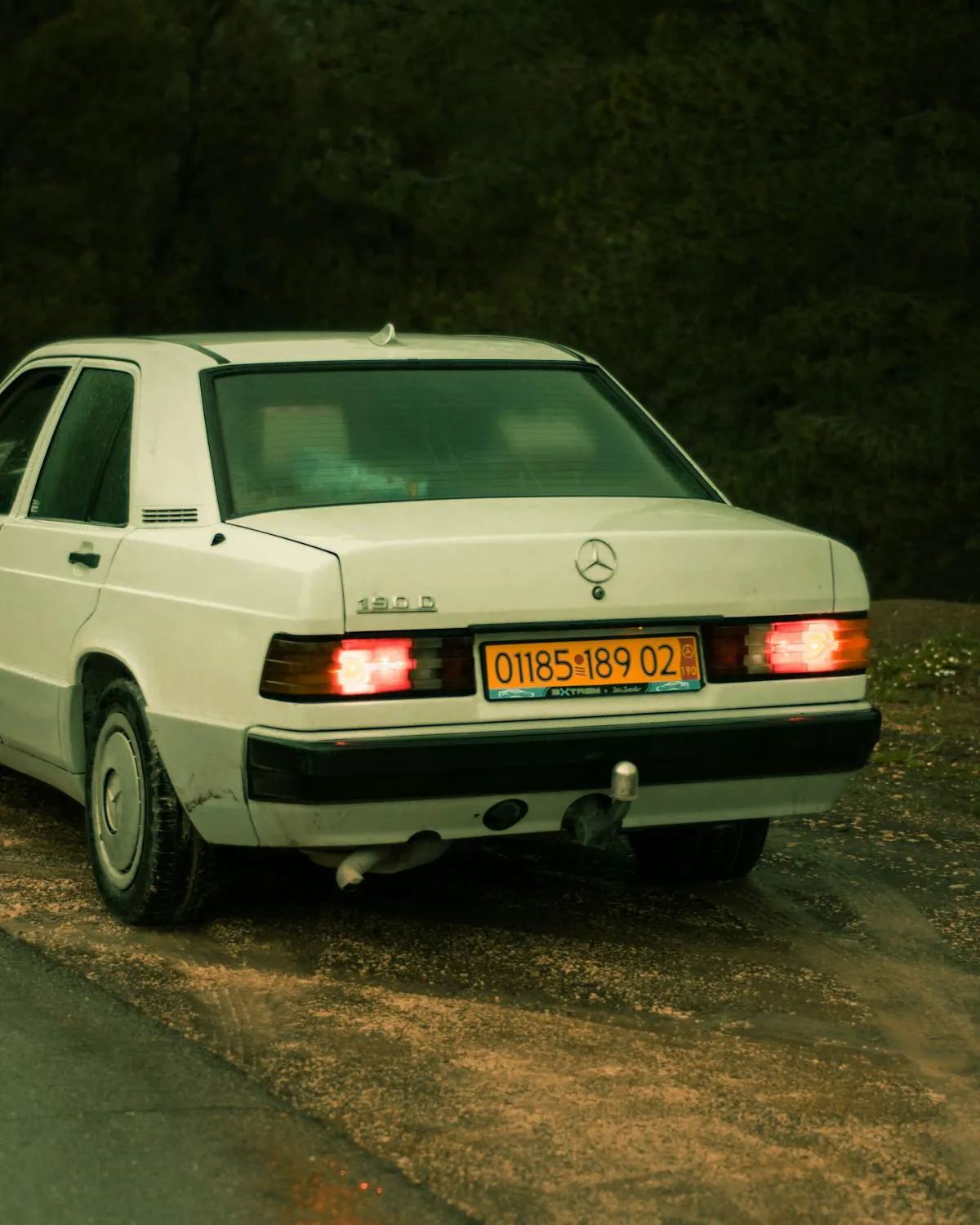 Classic White Mercedes Sedan Parked on Quiet Road Wallpaper