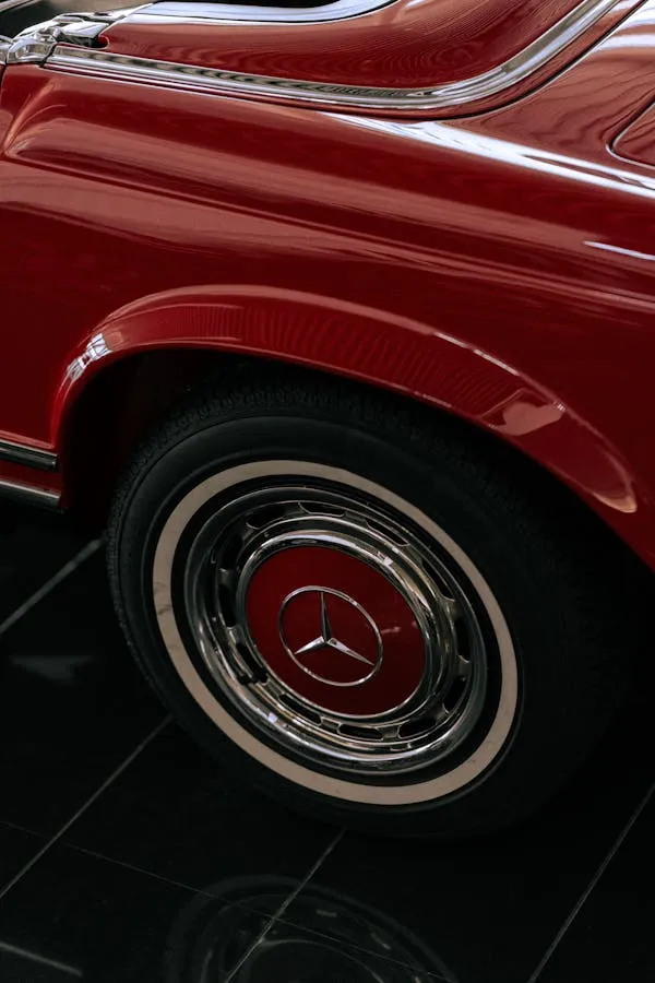 Close up of a vintage red Mercedes wheel and hubcap image