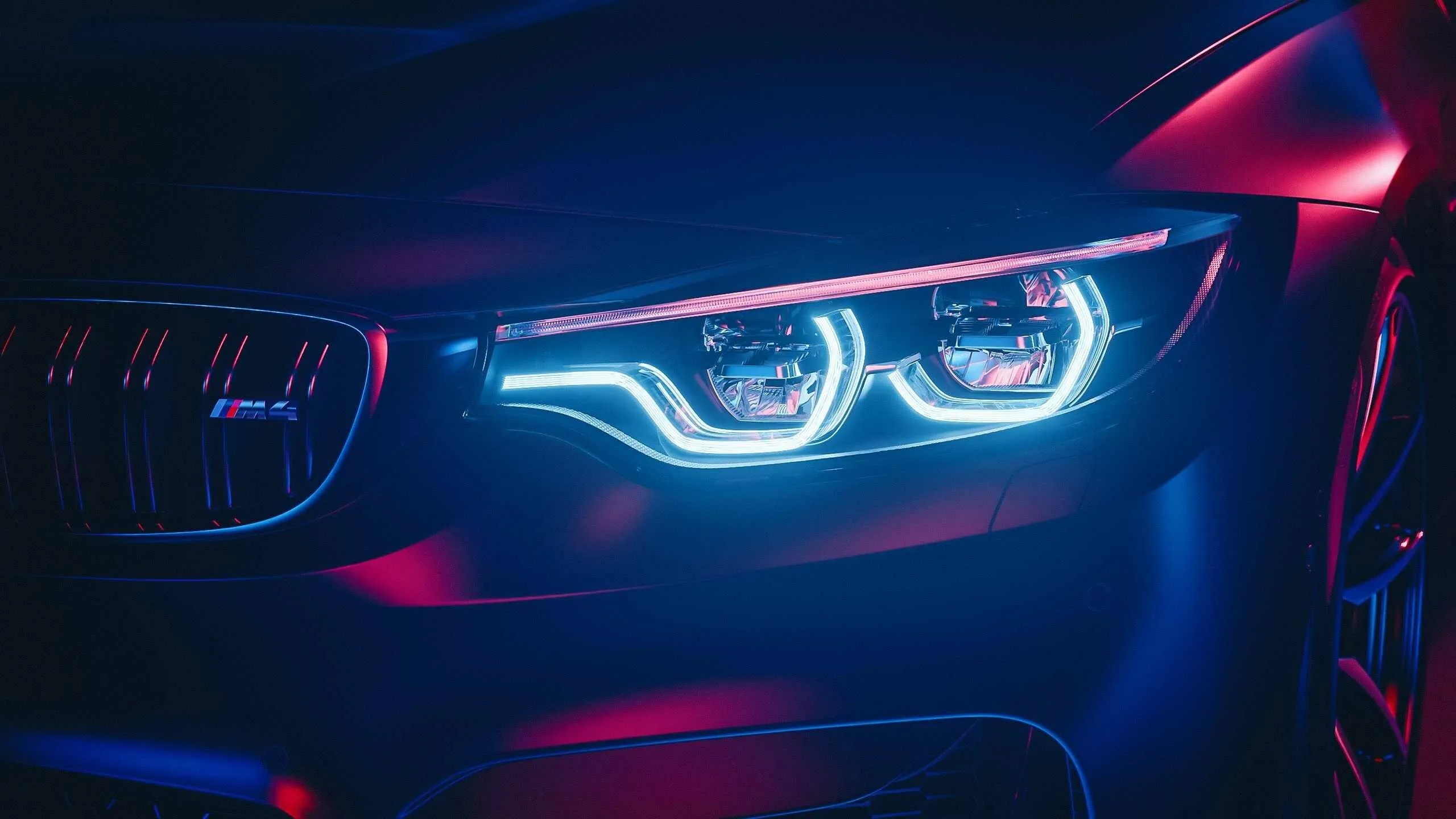 Close Up of Bmw Car Headlights with Neon Lighting Image
