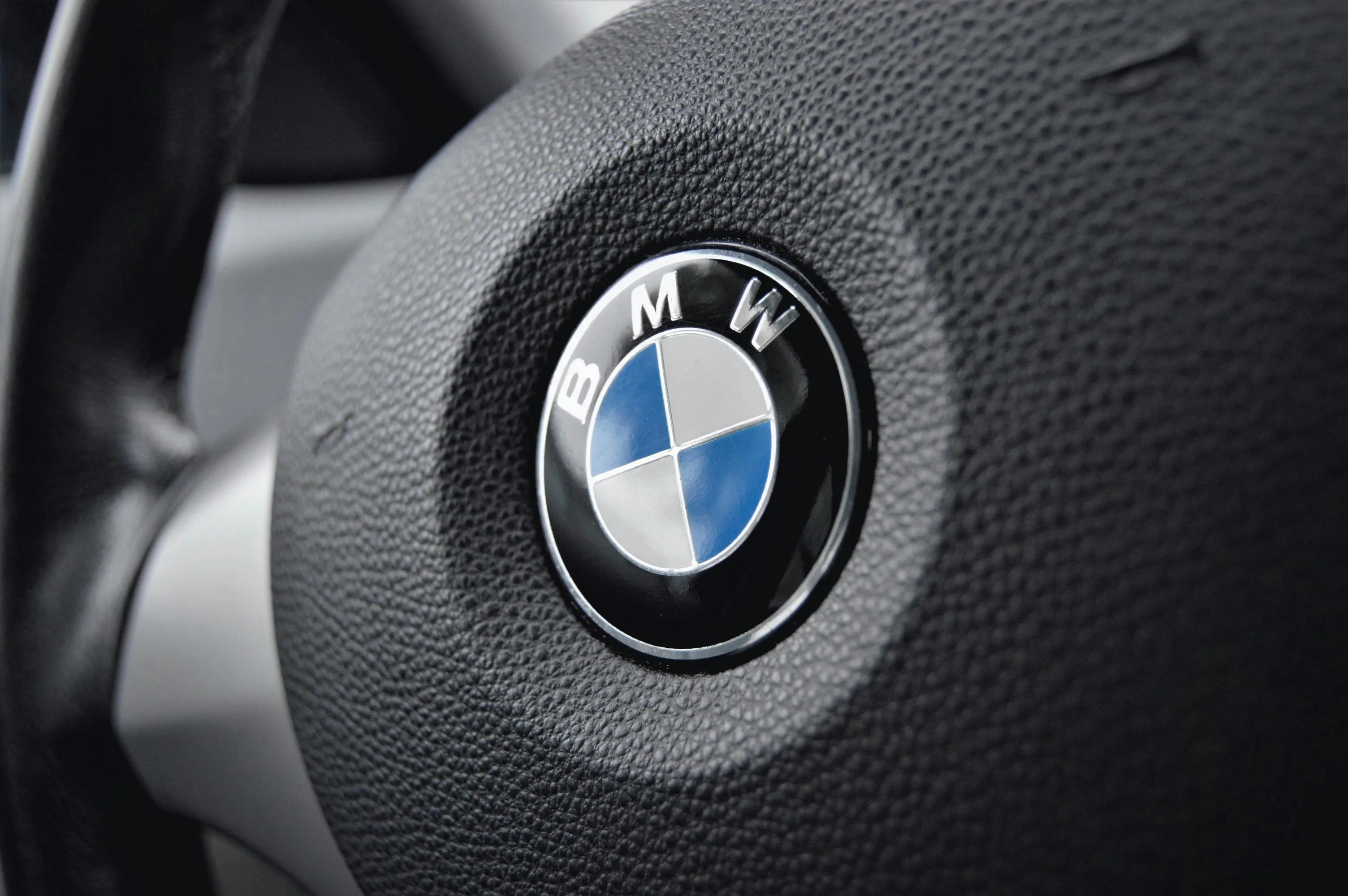 Close Up of Bmw Steering Wheel with Logo Centered Image