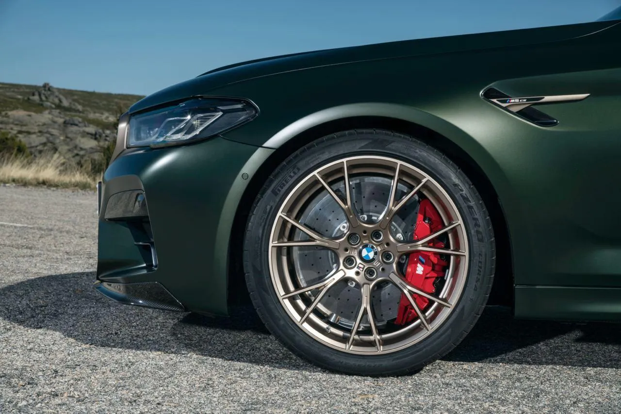Close Up of Bmw Wheel with Red Brake Caliper in Focus