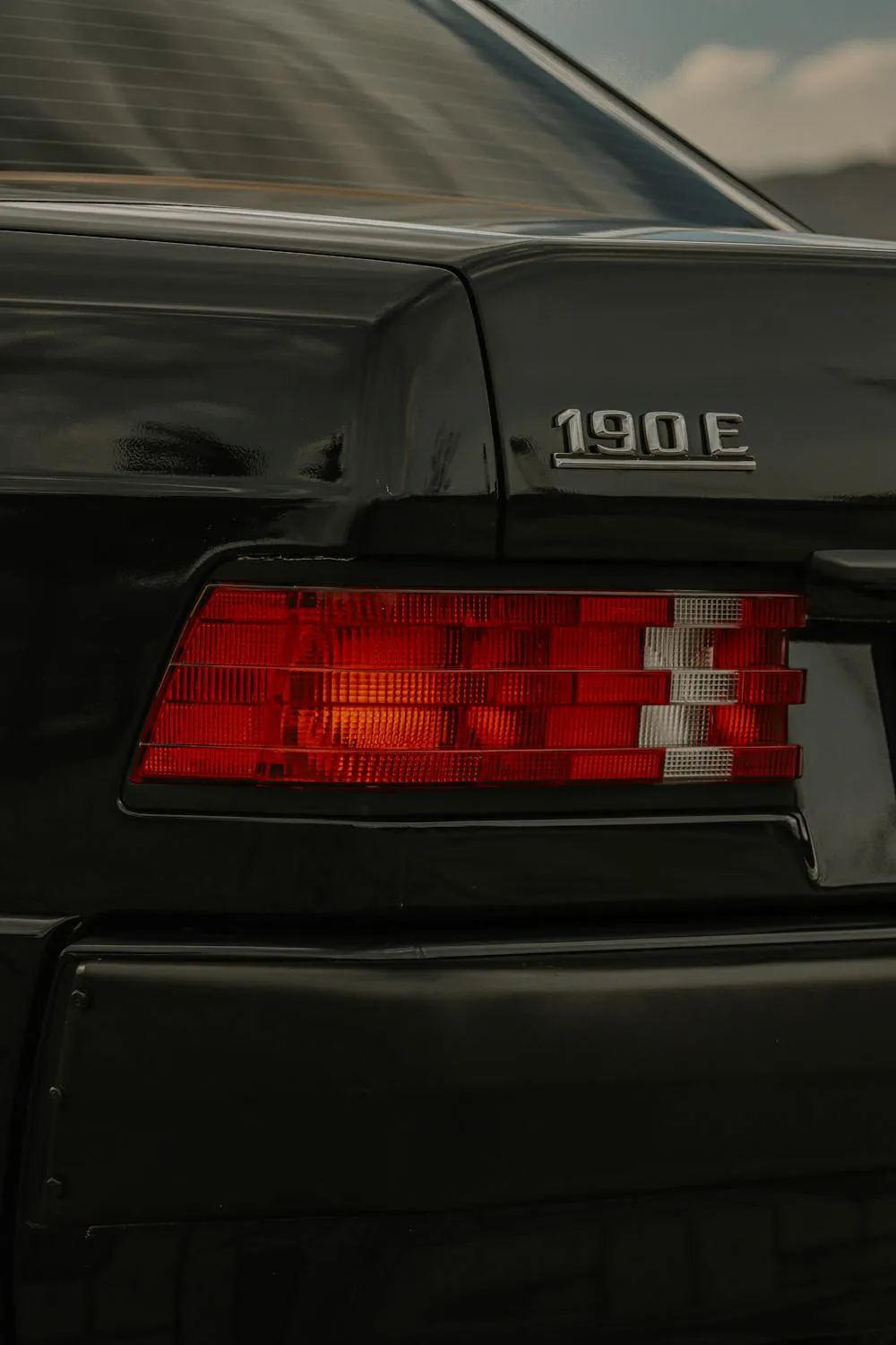 Close Up of Mercedes 190E Tail Light and Badge image
