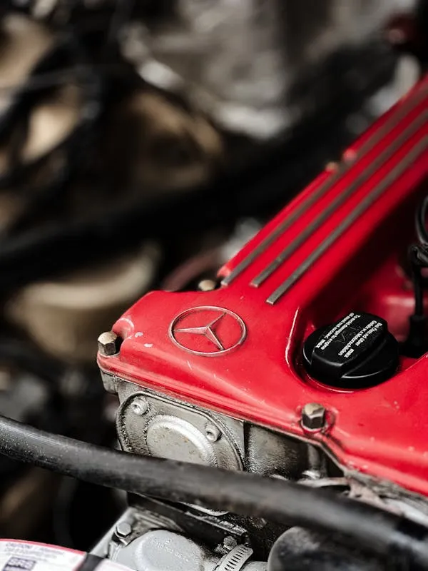 Close Up of Mercedes Benz Engine with Red Performance Cover