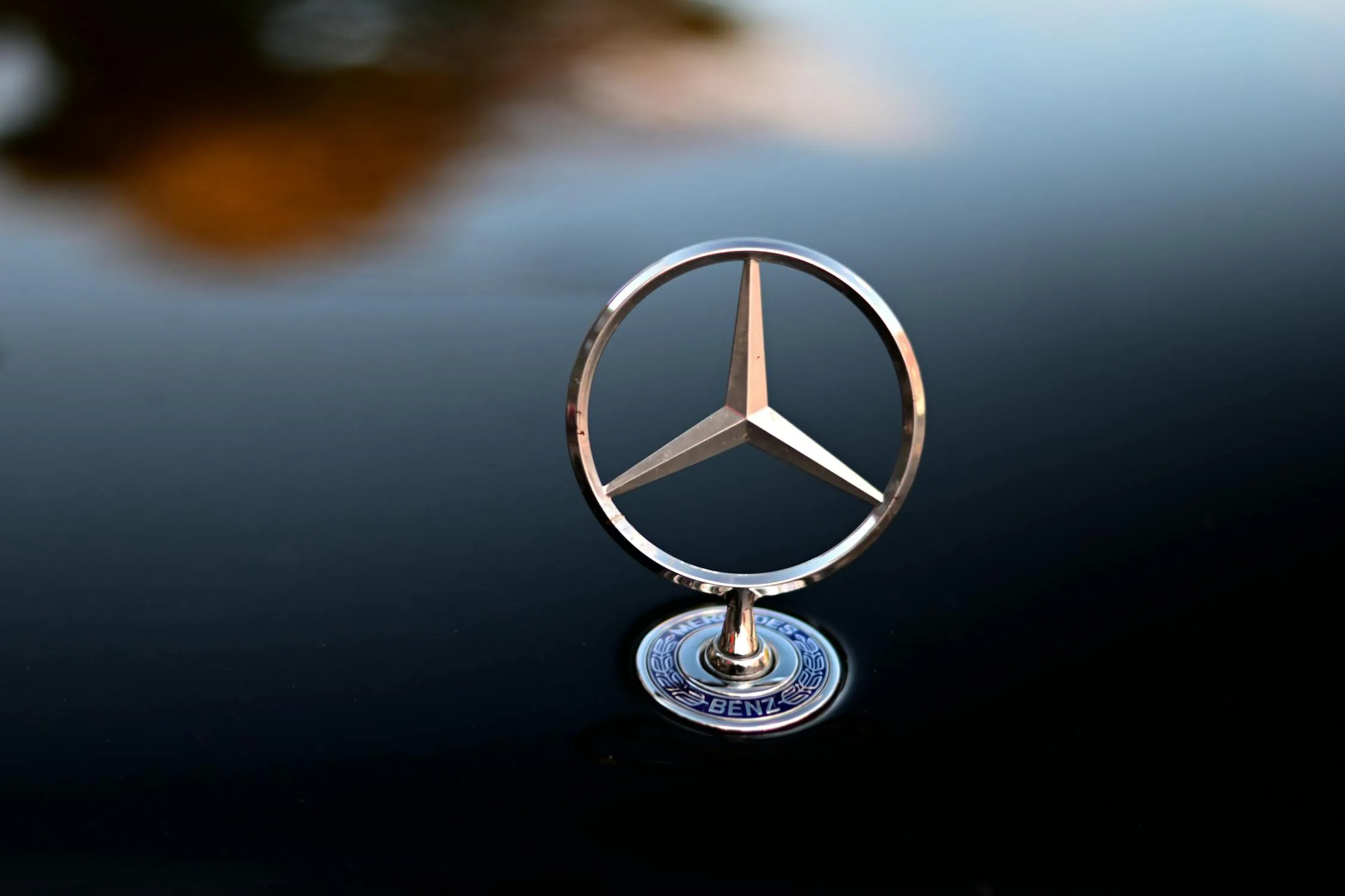 Close Up of Mercedes Logo on Polished Hood Surface image