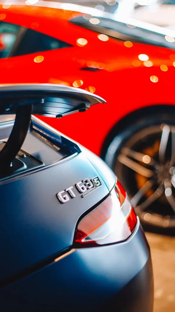 Close Up of Porsche Car Rear with Mercedes Benz in View