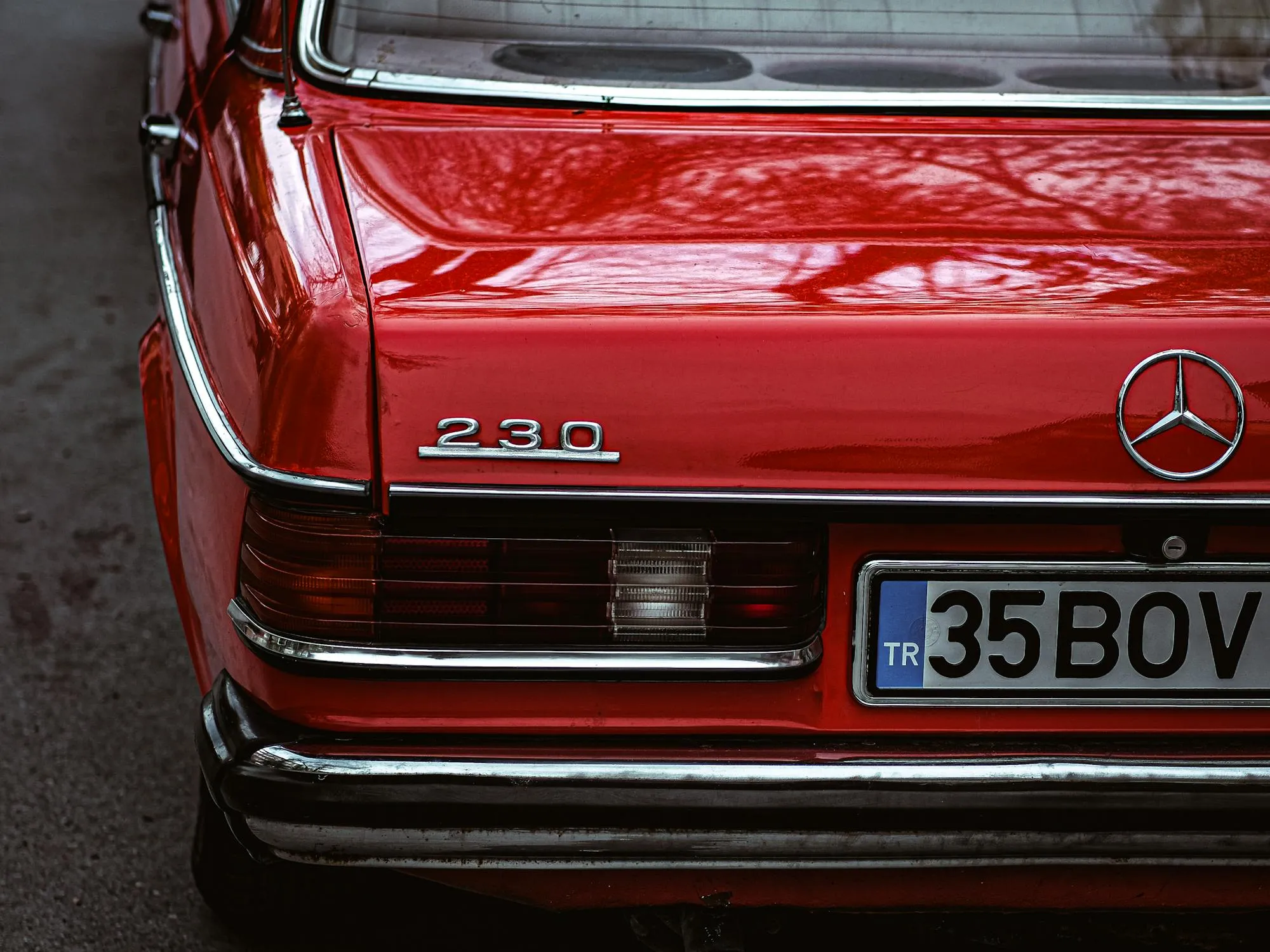Close Up of Red Classic Mercedes showing badge and logo