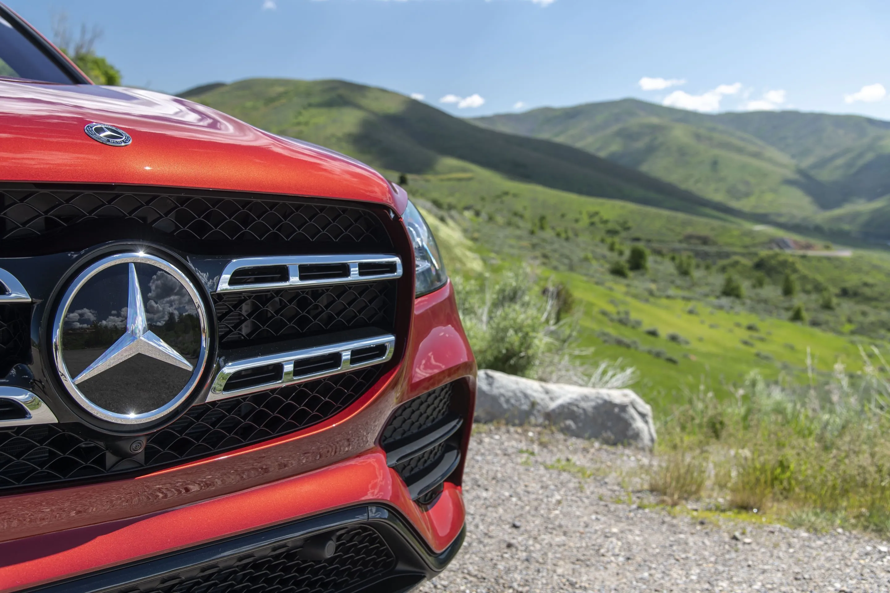 Close Up of Red Mercedes Benz Car with Mountain View