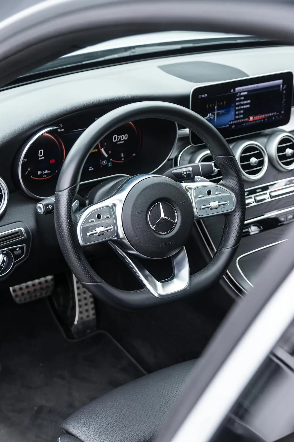 Close Up of Steering Wheel and Dashboard in Benz Car