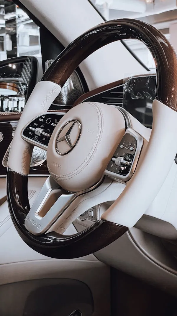 Close up of white Mercedes steering wheel and interior
