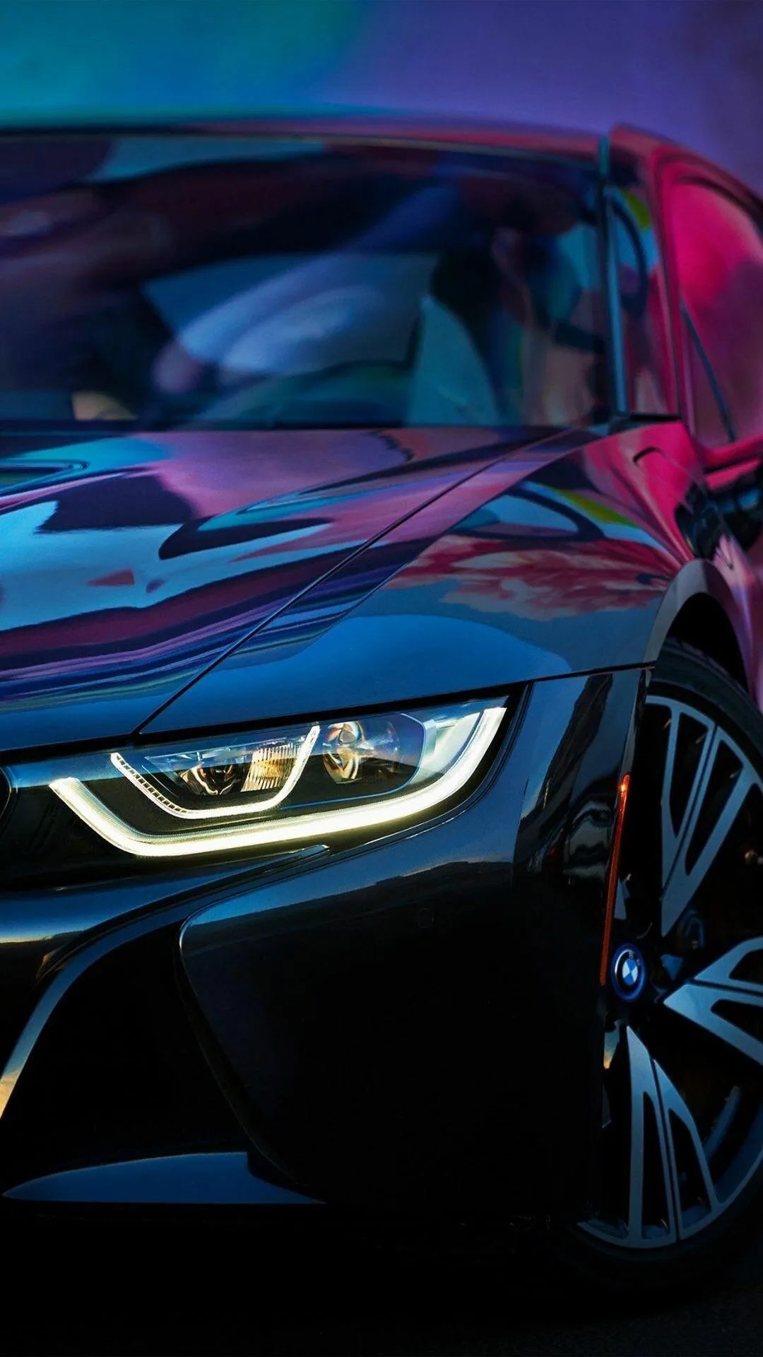 Close Up View of a Bmw Car with Vibrant Colored Lighting