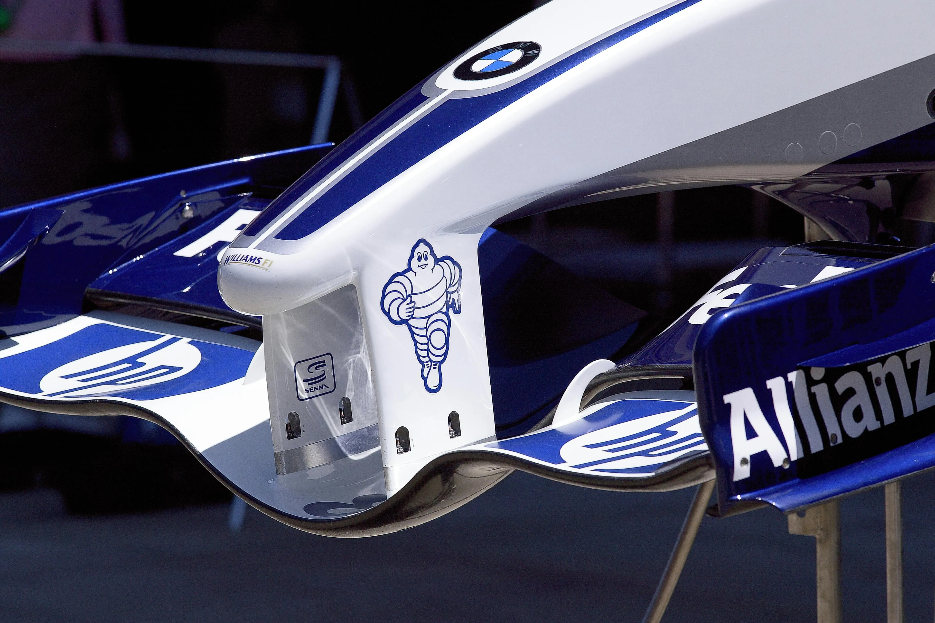 Close View of Bmw Racing Suspension and Branding Logo