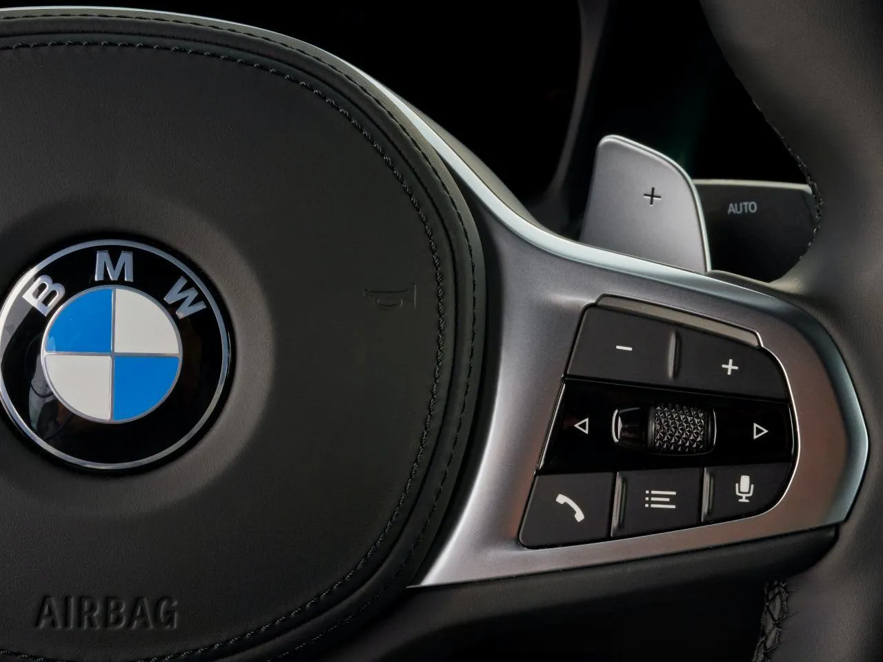 Close View of Bmw Steering Wheel with Control Buttons