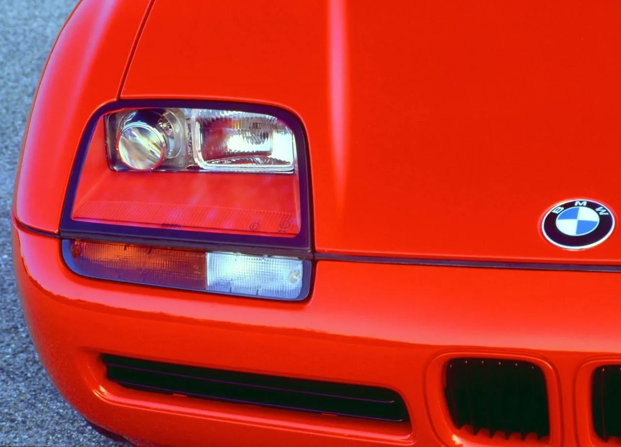 Close View of Red Bmw Headlights and Front Grille Detail