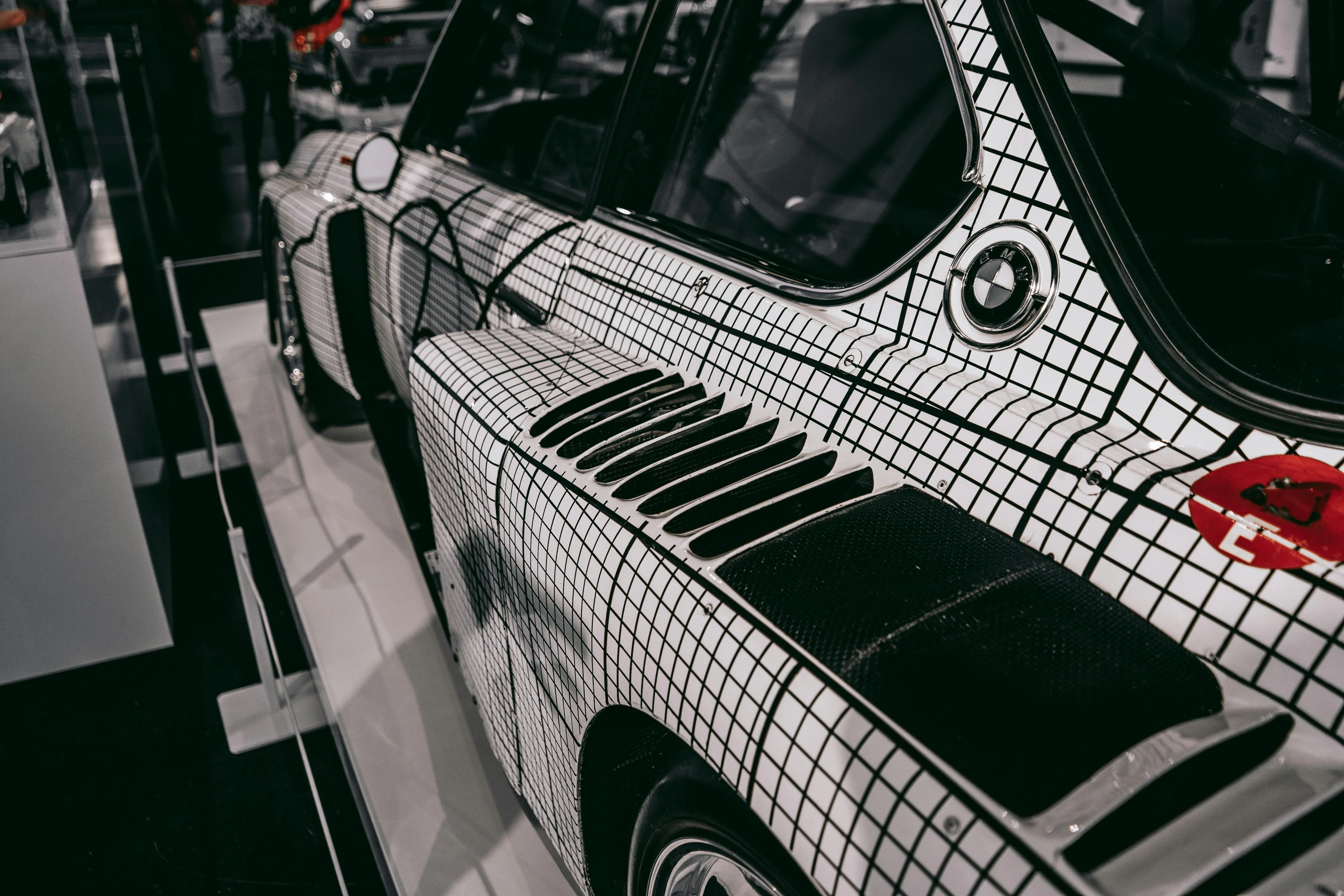 Close View of White Bmw with Black Pattern Wrap Image