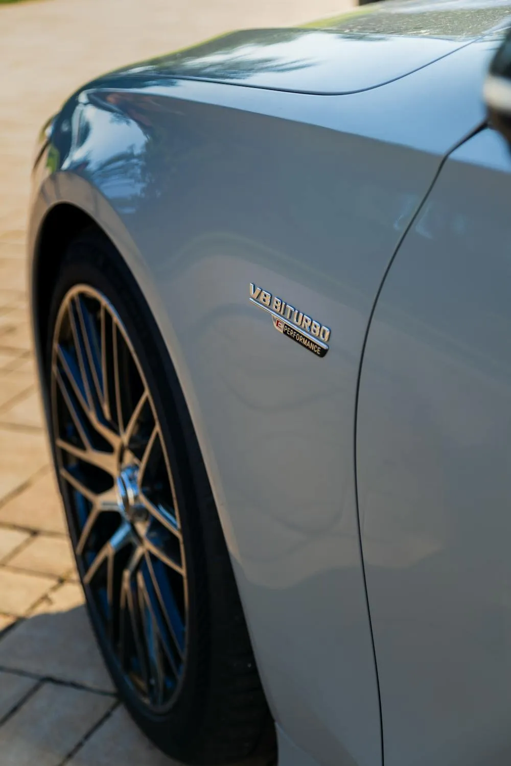 Closeup of AMG Wheel on Light Blue Mercedes Benz Wallpaper
