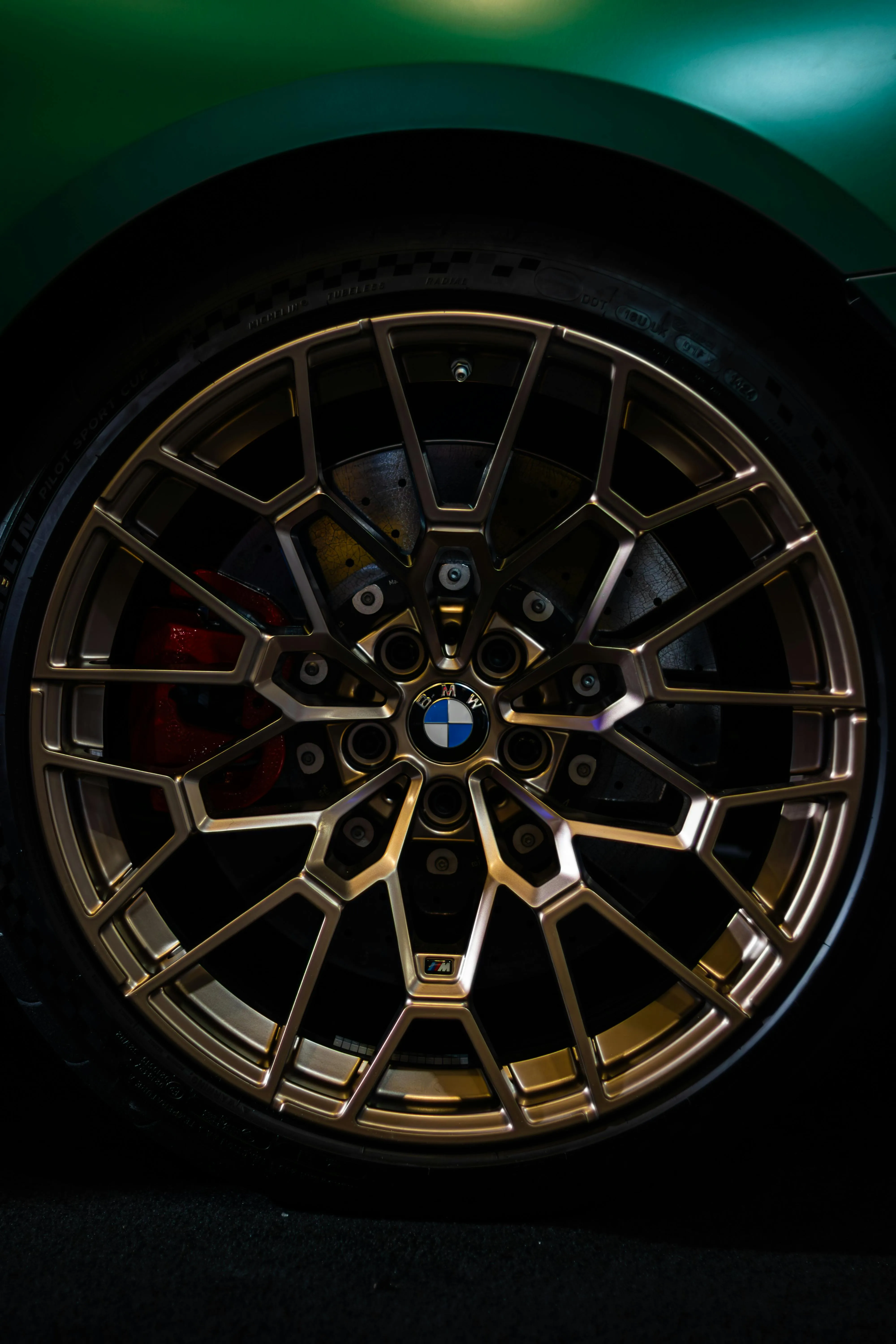 Closeup of Bmw Performance Alloy Wheel with Gold Finish