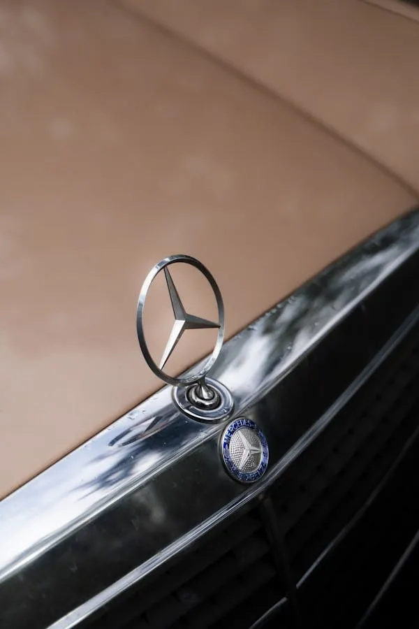Closeup of Classic Mercedes Benz Hood Ornament on Chrome Surface