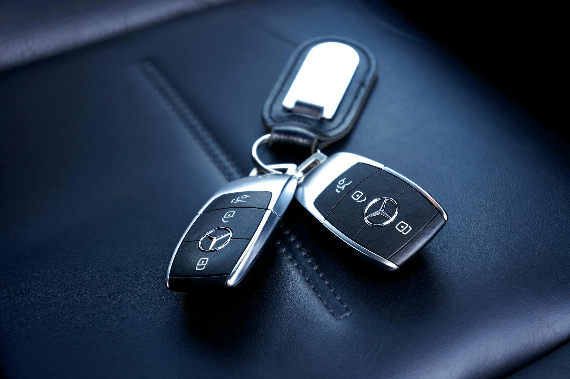 Closeup of Mercedes Benz Car Keys on Leather Surface