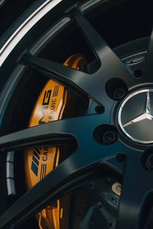 Closeup View of AMG Brake Caliper and Alloy Wheel Wallpaper