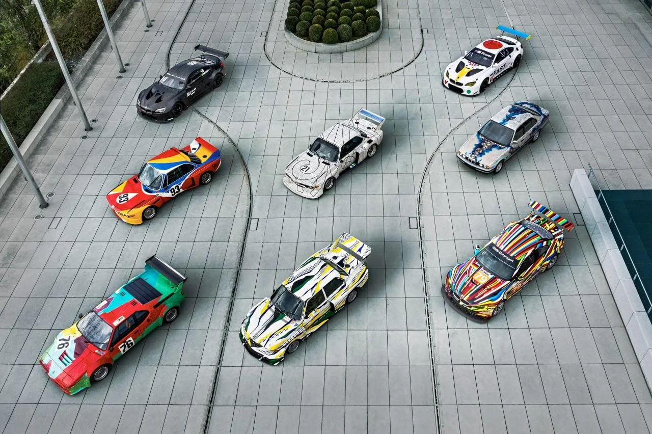 Collection of Bmw Toy Cars Arranged on Tiled Floor Wallpaper