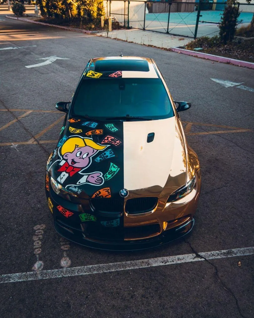 Colorful Art Covered Bmw Car Parked in Outdoor Lot Image