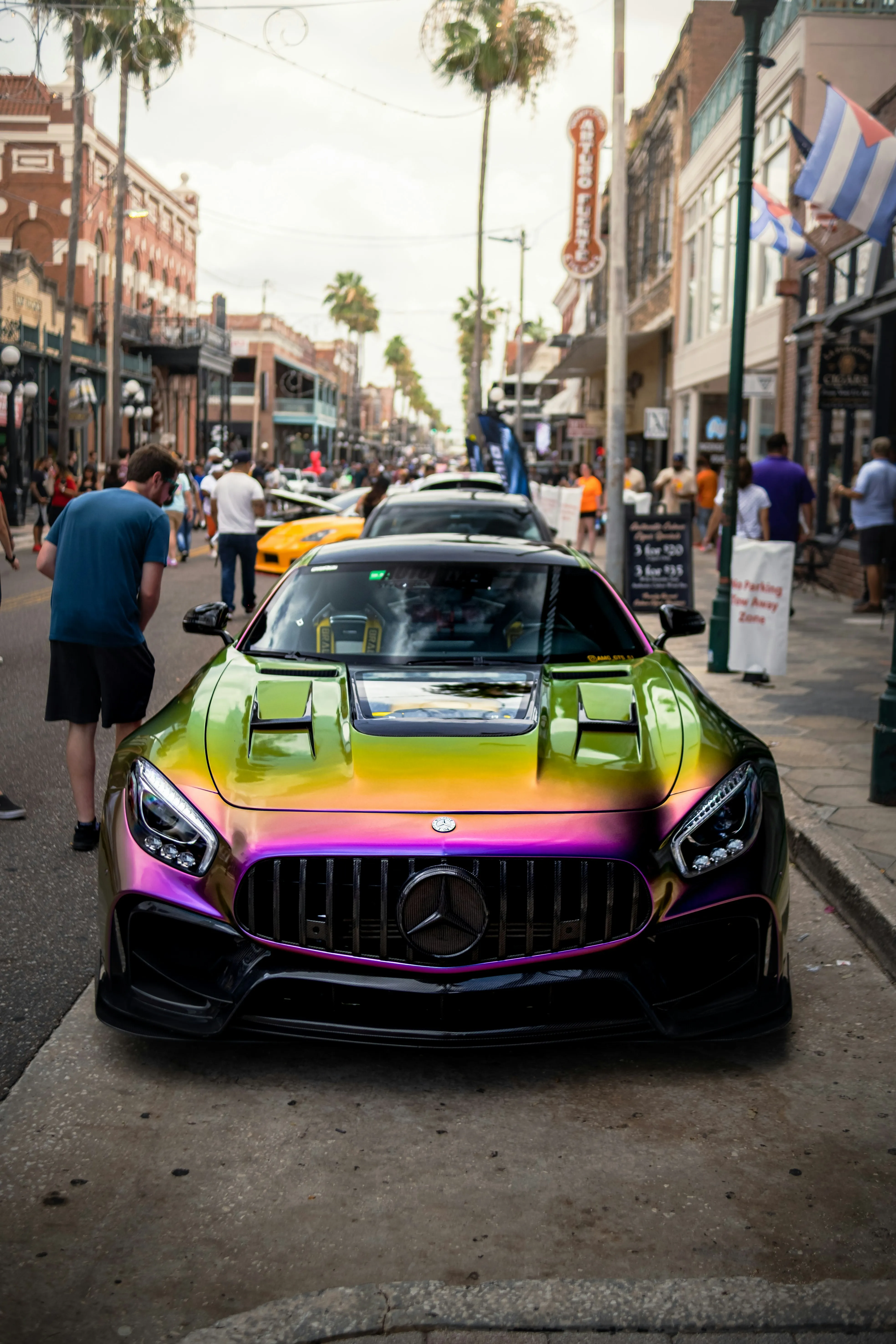 Colorful Mercedes Benz AMG on busy urban street image
